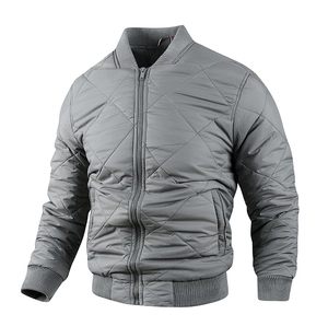 Detail of grey diamond-quilted men's bomber jacket with ribbed cuffs and collar