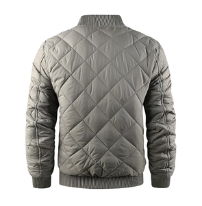 Detail view of the quilted diamond pattern and ribbed cuffs on the men's winter bomber jacket