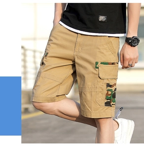 Detail of khaki cargo shorts showing the camouflage pattern on the side flap pocket