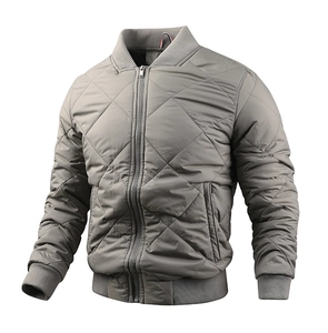 Detailed view of grey quilted bomber jacket with stand collar and ribbed cuffs