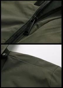 Detailed close-up of olive green tactical jacket featuring zipper and windproof fabric