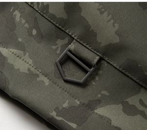 Macro shot of durable camo fabric texture with a matte black metal buckle detail