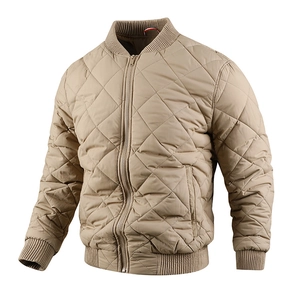 Detail of diamond-quilted bomber jacket featuring a ribbed stand collar and metal zipper