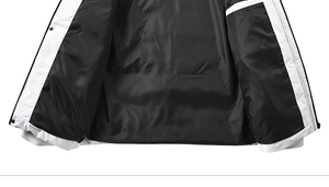 Detail of windproof white outer fabric and shiny black quilted lining with button snaps