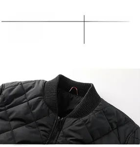 Detail of black quilted bomber jacket with diamond stitching and ribbed knit collar