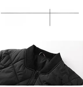 Detail of black quilted jacket with ribbed baseball collar and metallic zipper finish