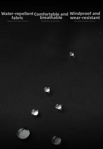 Close-up of black windproof and water-repellent jacket fabric with clear water droplets