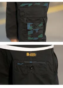 Detail of cargo shorts featuring camouflage patch pockets and woven brand label