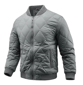 Detail of grey diamond quilted men jacket with ribbed collar and metallic zipper texture