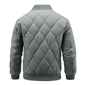Rear view showing large diamond quilting pattern on gray men's bomber jacket with ribbed hem