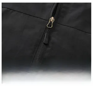 Detail of durable black metal zipper on water-resistant nylon jacket for men