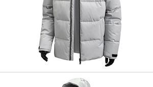 Detail of grey winter jacket featuring adjustable Velcro cuffs and contrast black zipper