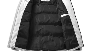 Detailed macro view of hooded jacket inner black quilted lining and hidden pocket detail