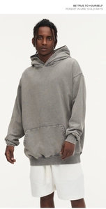 Detail of heavyweight mineral washed charcoal gray hoodie with relaxed dropped shoulders
