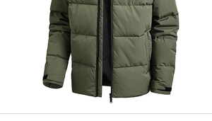 Detail of army green outdoor jacket showing windproof fabric and adjustable velcro cuffs
