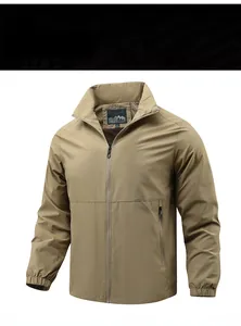 Detail view of khaki outdoor jacket collar showing brand label and zipper texture