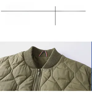 Detail of olive green quilted bomber jacket with ribbed collar and metal zipper