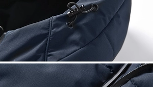 Detail of windproof fabric showing hood drawstring toggles and waterproof zipper
