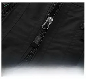 Detail of high-quality zipper with SPORTS puller on black outdoor fishing vest