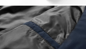 Detailed macro view of the insulated inner lining and hidden pocket on a winter jacket