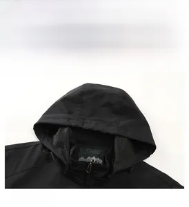 Detail view of black hooded jacket with zip closure and breathable mesh lining