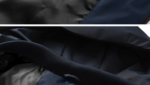 Detailed close-up of heavy-duty zipper and ribbed elastic cuff on men's winter jacket