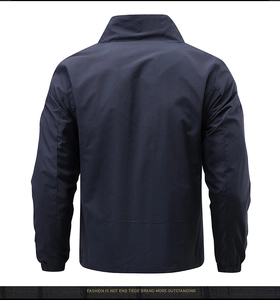 Detail view of navy blue outdoor jacket featuring elastic cuffs and lightweight windproof fabric