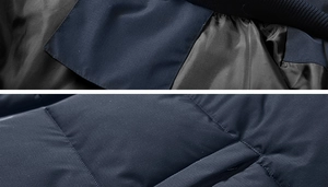 Detailed macro view of hooded jacket with quilted navy fabric and inner pocket