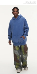Detail of heavyweight cotton washed blue hoodie with drop shoulders and baggy fit