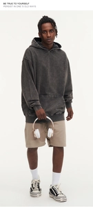 Close-up of charcoal wash hoodie with oversized fit and street style details
