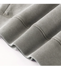 Macro shot of high-quality grey heavy cotton fabric with ribbed hem detail