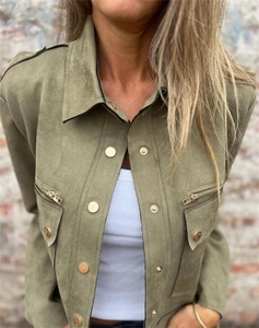 Detail of army green faux suede jacket featuring metal zipper pockets and lapel collar