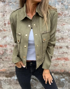 Detail of army green faux suede jacket featuring golden buttons and metal zipper pockets