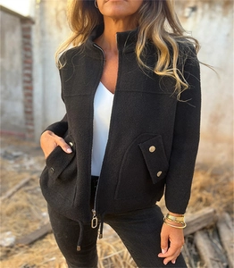 Detail view of black fleece blazer featuring lapel collar and drawstring hem for women