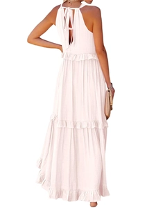 Detail view of pink bohemian tiered maxi dress with halter neck and open back tie design