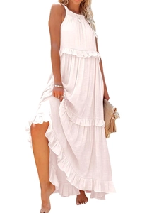 Detail of multi-tiered ruffle hem and lightweight fabric on summer halter maxi dress