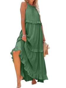 Detailed view of layered ruffle tiers on a light green bohemian halter summer dress