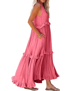 Detail of rose pink tiered maxi dress featuring layered ruffles and textured fabric