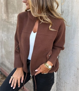 Close-up of caramel brown fleece jacket showing zipper detail and texture