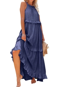 Detail view of denim blue tiered ruffle hem on a summer halter long dress