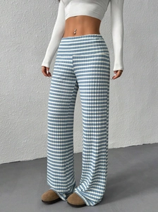 Vertical detail of blue and white striped knit wide-leg pants with high waist fit