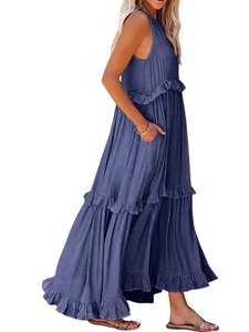 Detail of navy blue tiered maxi dress showing ruffled edges and side pockets for casual wear