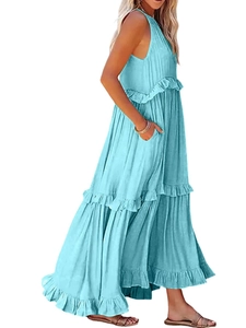 Detail of light blue tiered maxi dress featuring a V-neck and practical side pockets