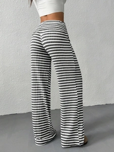 Detailed view of the black and white striped knit texture and high waisted elastic band
