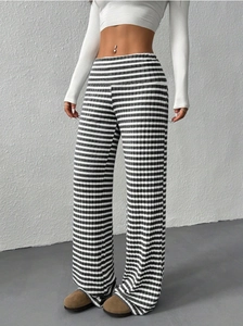Detail of high-waist striped wide-leg trousers showing knit texture and vertical lines