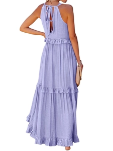 Back view of a lilac tiered maxi dress with halter neck tie and ruffle hem details