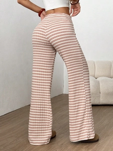 Close-up of pink and white striped high-waisted wide leg pants with vertical ribbed texture
