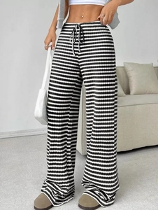 Detail of knit striped wide-leg pants with elastic drawstring waist for casual women wear