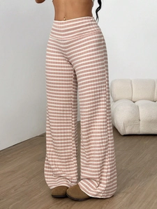 Detail view of pink and white striped wide-leg trousers with vertical rib knit texture