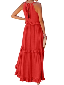 Detail of red backless halter maxi dress with tiered cake skirt and bow tie closure